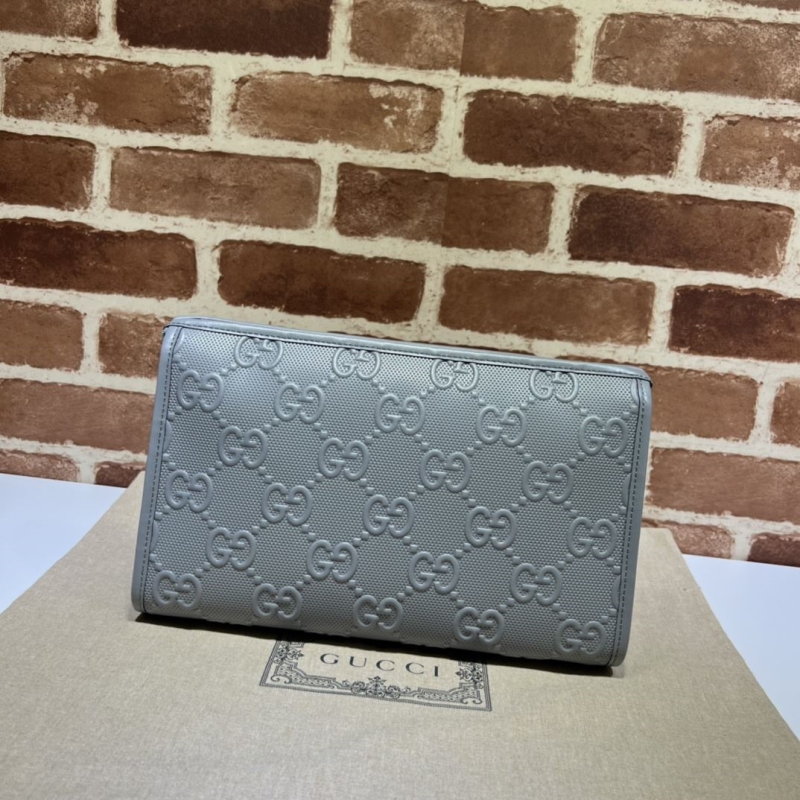 G*u*i clutch bags